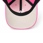 Close-up of a pink and beige cap with a black interior on a white background
