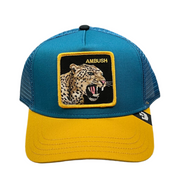 the front side of ambush jaguar goorin bros trucker hat teal and yellow