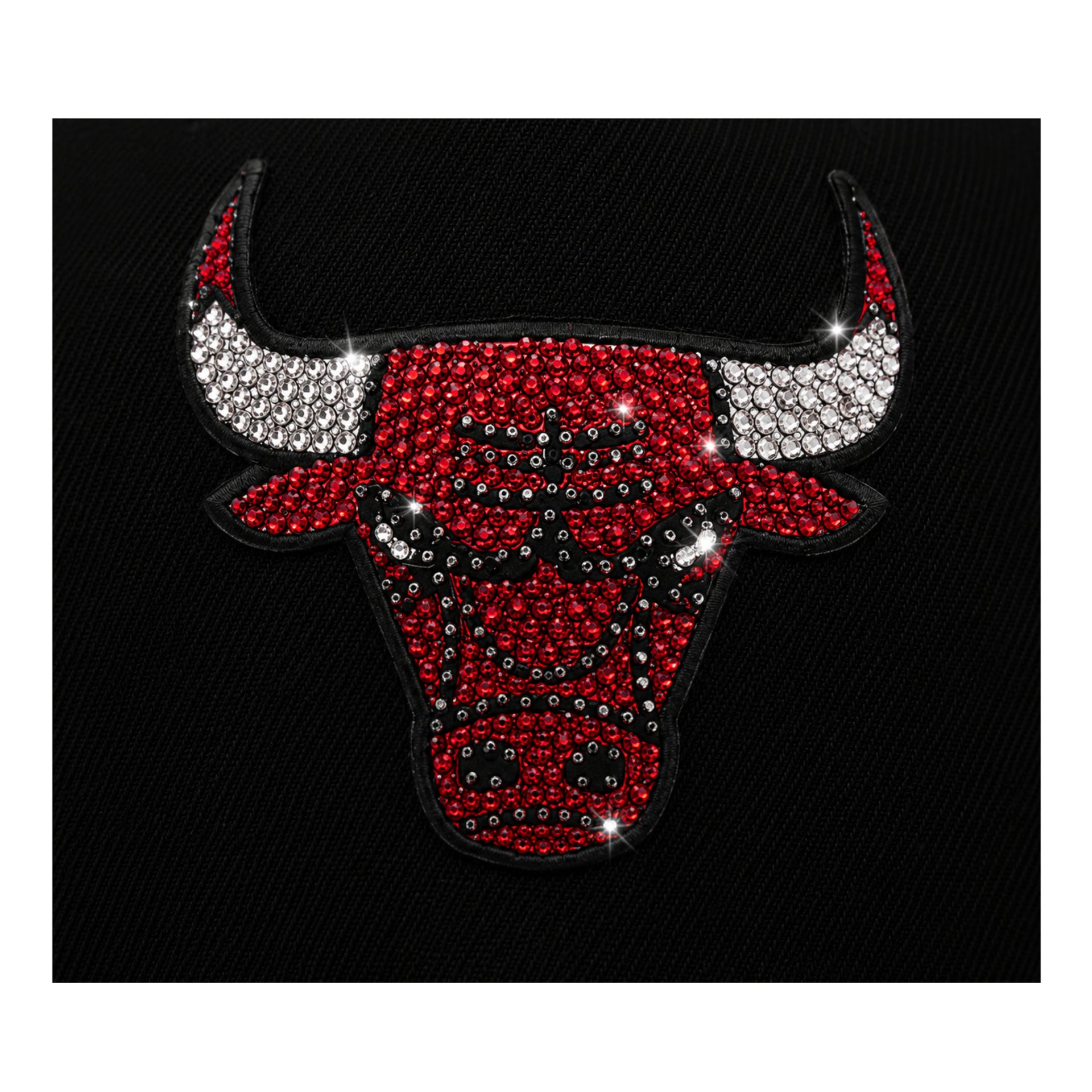 Red and white bull head logo with rhinestones on a black background