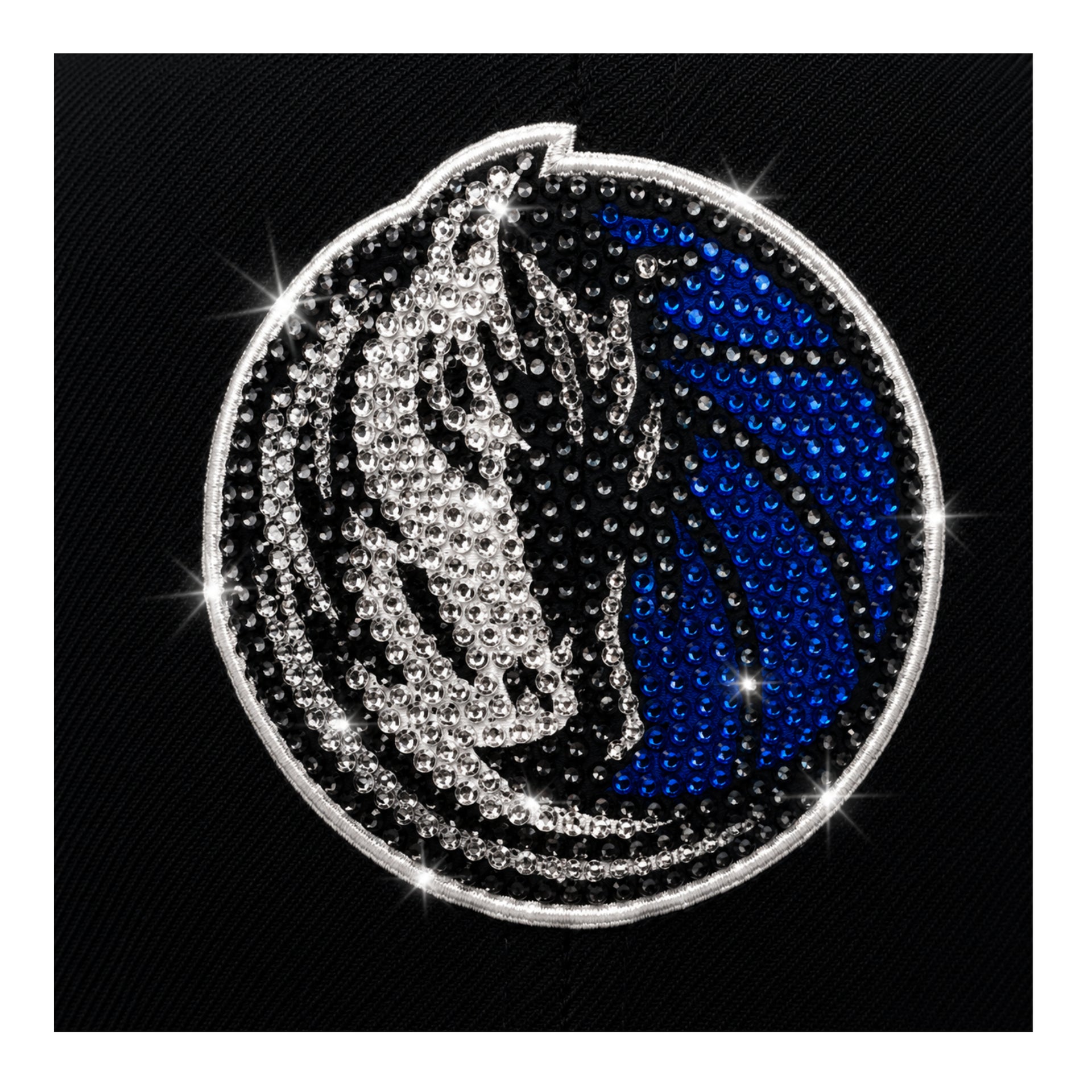 Decorative emblem with a blue and silver design on a black background
