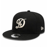 New Era Los Angeles Dodgers City Connect Black Ivory 9FIFTY Snapback Hat front angle view