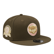 Brown New Era 59FIFTY fitted cap featuring a pink and beige Chicago Cubs bear logo on the front and a gold-stitched 1990 MLB All-Star Game side patch, displayed on a white background