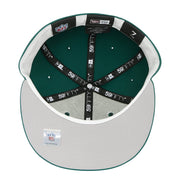 Top view of a green and gray baseball cap with '59Fifty' branding on a white background