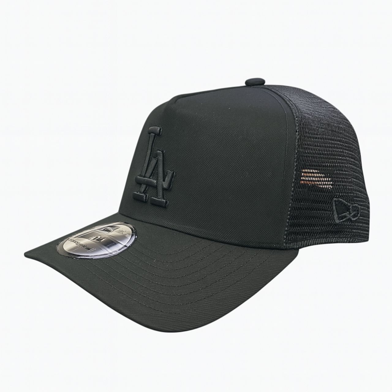 Side View of A black New Era 9FORTY A-Frame trucker style cap with an all-black LA logo, displayed on a white background.