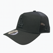 Side View of A black New Era 9FORTY A-Frame trucker style cap with an all-black LA logo, displayed on a white background.