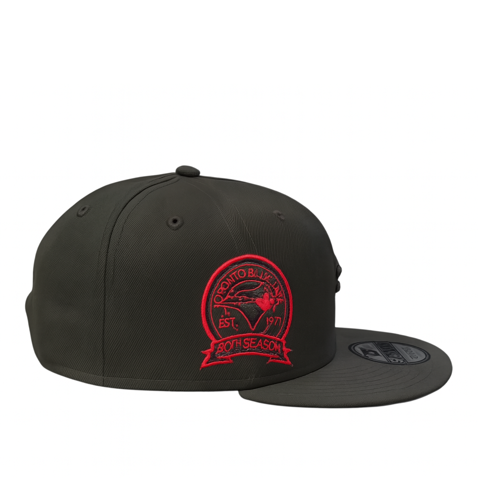 Side view of the black Toronto Blue Jays 9FIFTY snapback featuring a red embroidered 40th Season patch on the side panel.