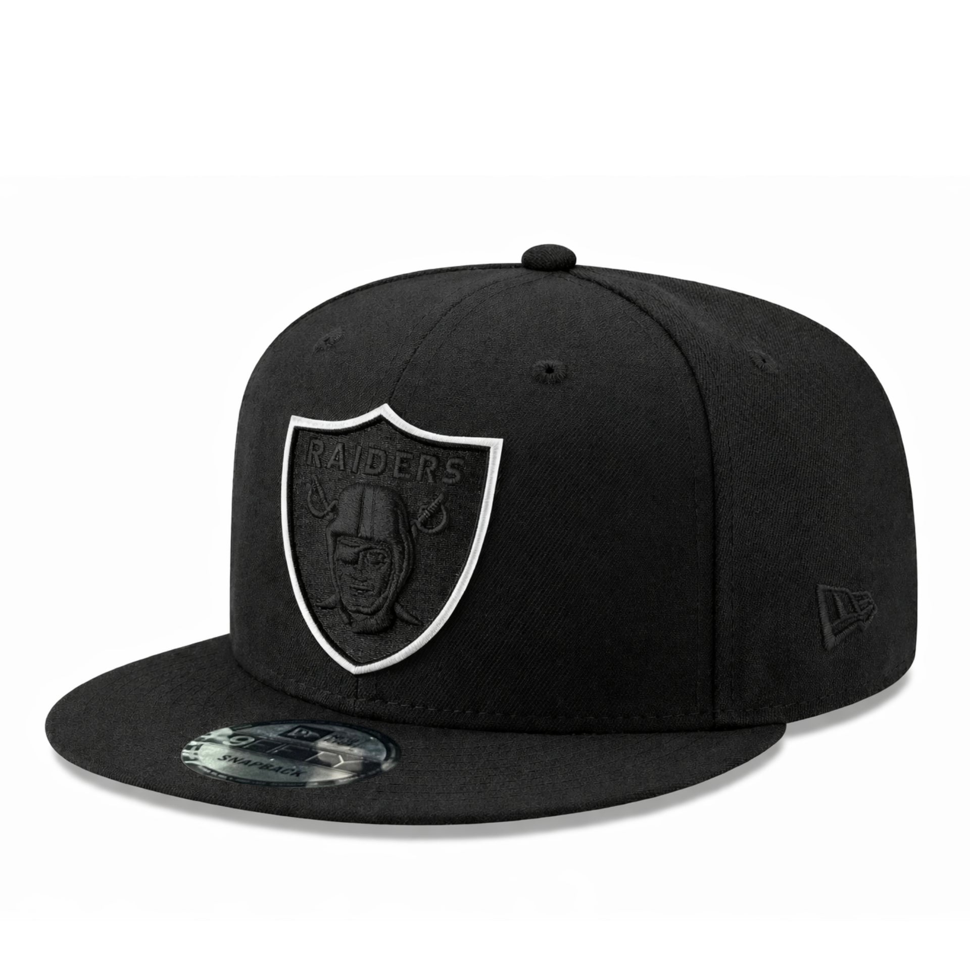 side view of Black cap with a black raiders logo and white outline on a white background