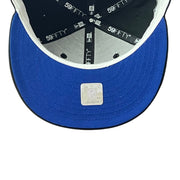 black baseball cap with blue under brim and '59FIFTY' branding on a white background