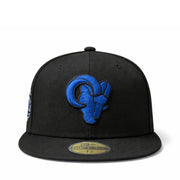 Black cap with blue los angeles rams baseball team logo on a white background