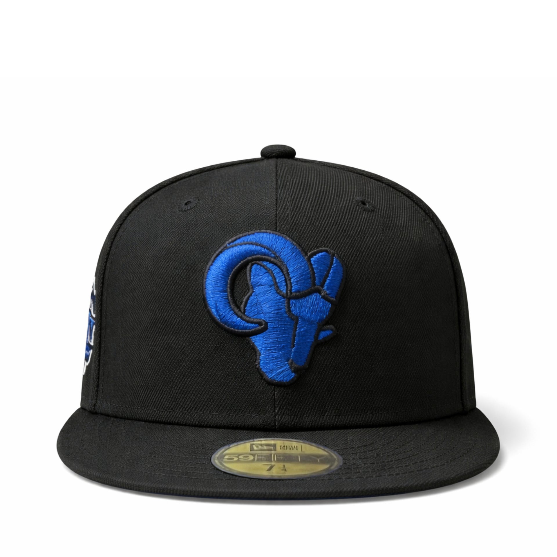 Black cap with blue los angeles rams baseball team logo on a white background