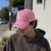 Man wearing ’47 Brand Los Angeles Dodgers pink MVP adjustable hat with white LA logo