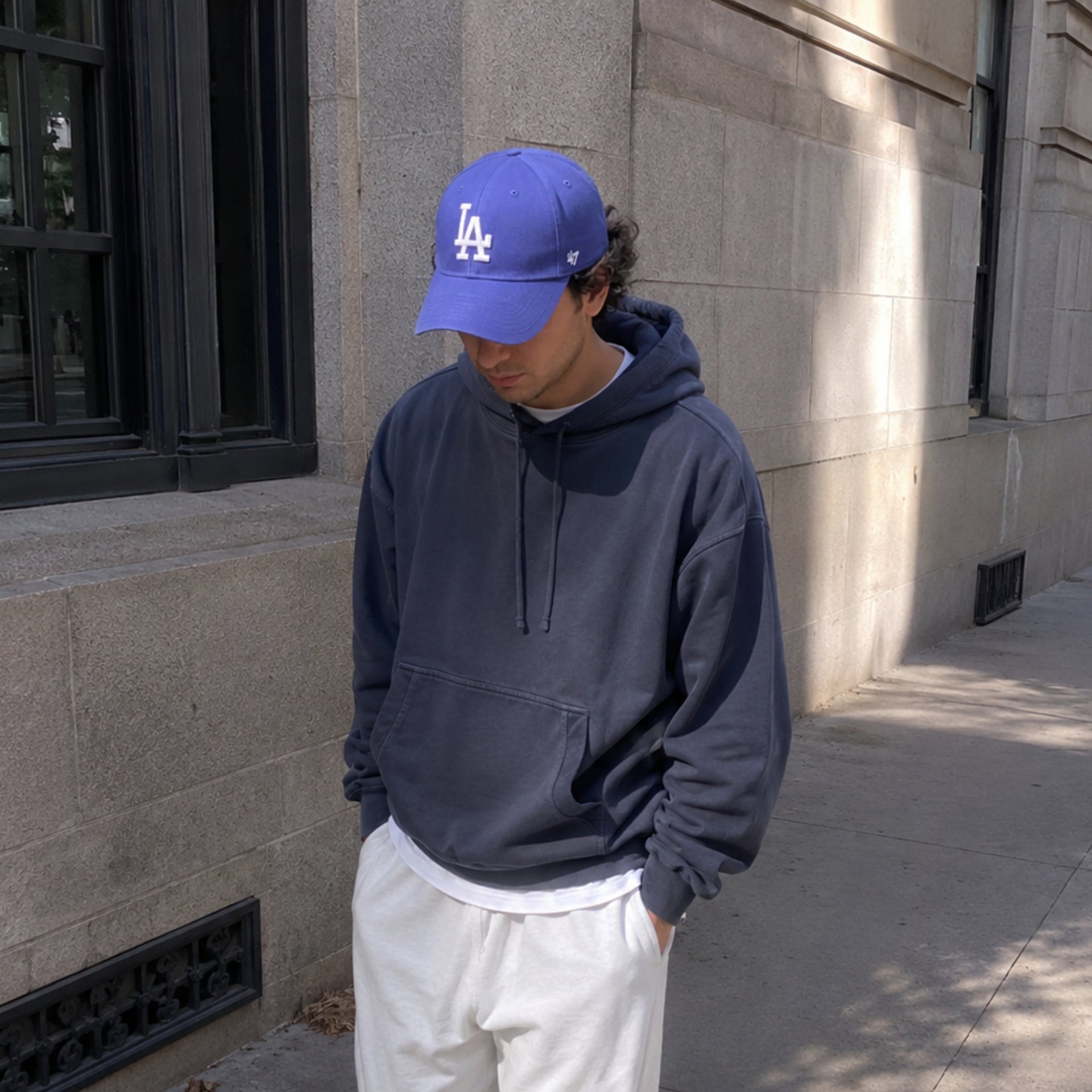 Man wearing ’47 Brand Los Angeles Dodgers royal blue MVP adjustable hat with white LA logo