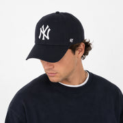 Lifestyle photo of dark navy New York Yankees ’47 MVP adjustable baseball cap on model
