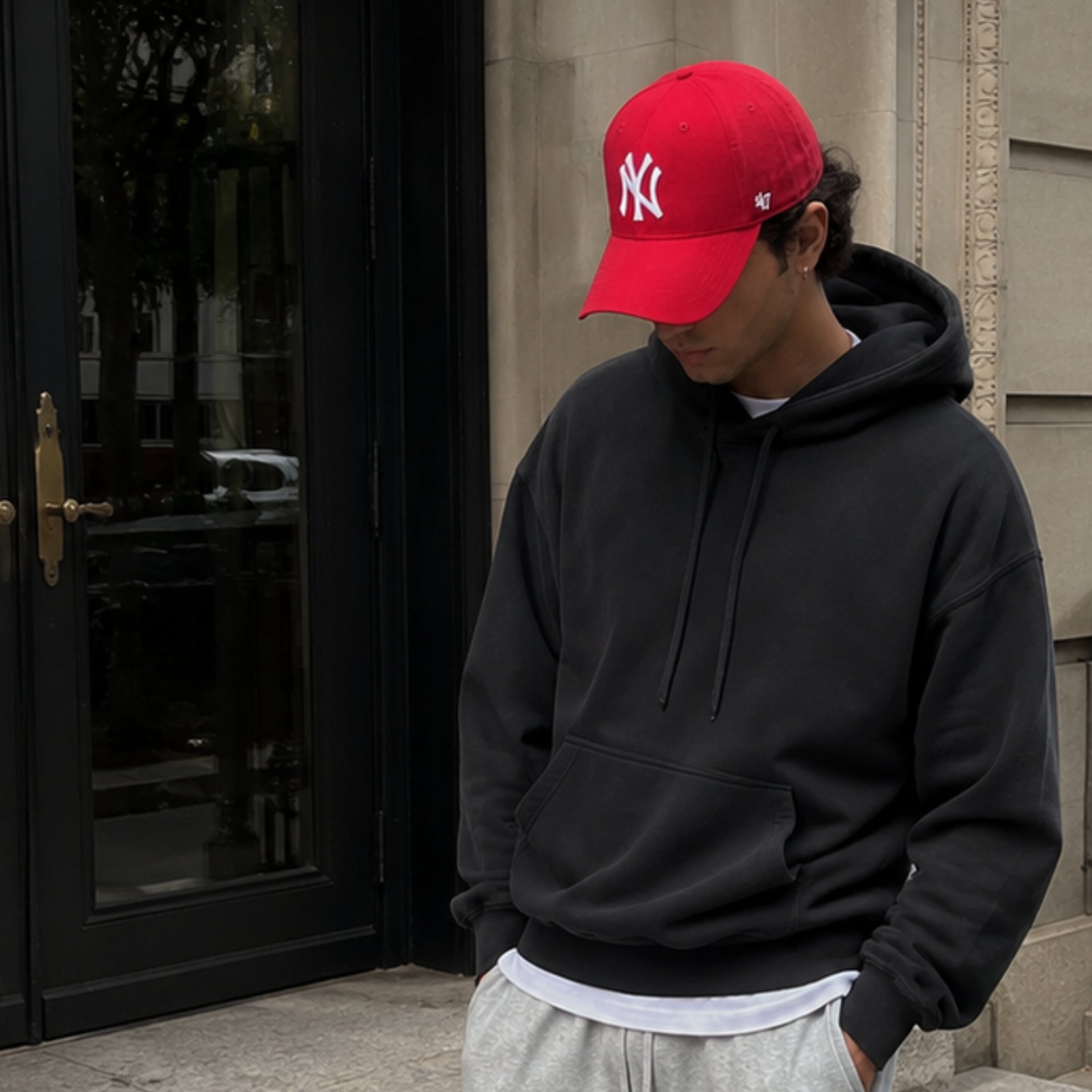 Man wearing ’47 Brand New York Yankees red MVP adjustable hat with white NY logo
