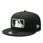 Black baseball cap with white mlb umpire batterman logo on a white background