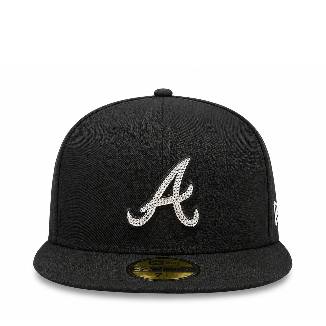 A black baseball cap featuring a silver rhinestone-embellished Atlanta Braves 'A' logo on the front, with a gold size sticker on the flat brim and a white New Era flag on the side.