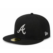 A black New York Yankees fitted baseball cap with a white embroidered NY logo on the front and a white New Era logo on the side, shown on a plain white background.