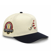 New Era Atlanta Braves USA 250th Anniversary 9FIFTY A-Frame snapback hat with cream crown, navy visor, and patriotic Braves logo