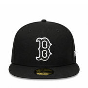 A black fitted baseball cap with a white embroidered Boston Red Sox 'B' logo on the front and a gold New Era 59FIFTY sticker on the visor, shown against a plain white background.