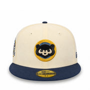 A cream and navy blue New Era 59FIFTY fitted cap featuring a custom embroidered panda patch on the front, displayed on a clean white background.