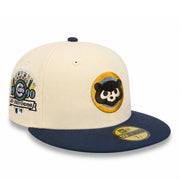 A New Era 59FIFTY fitted baseball cap featuring a cream crown and navy blue brim. The front panel has an embroidered Chicago Cubs panda patch, and the side displays a Chicago Cubs 1990 All-Star Game commemorative patch.