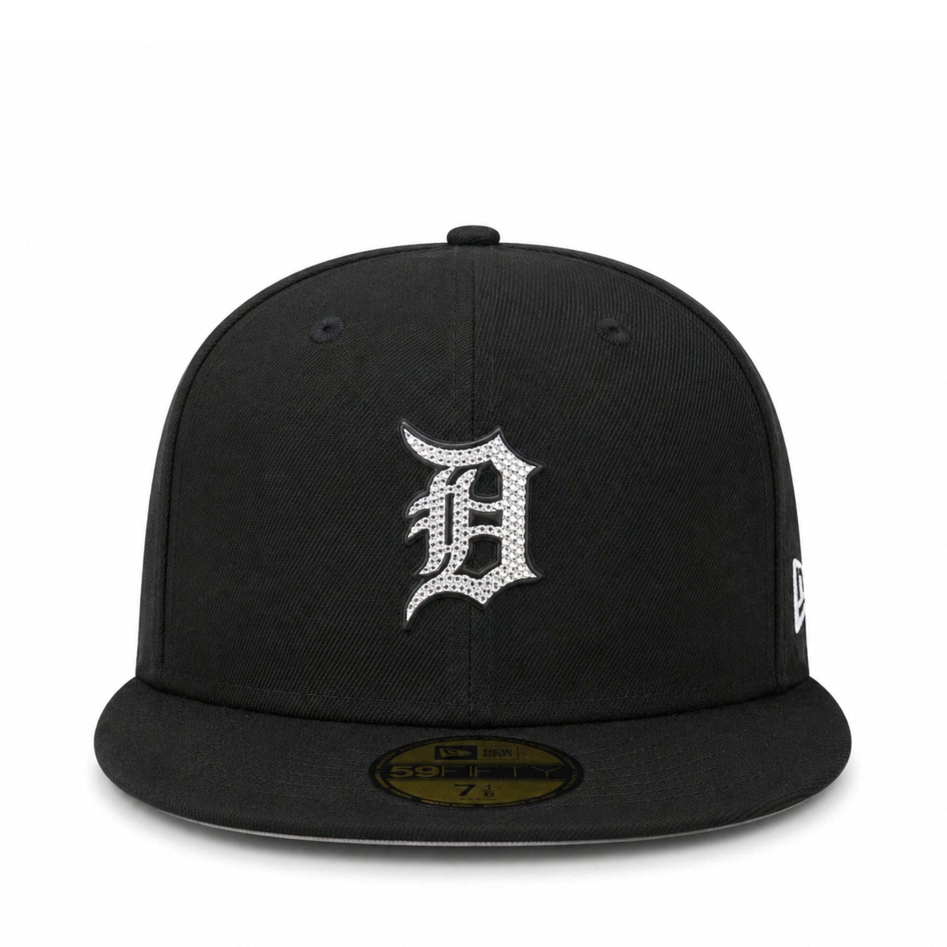 A black fitted baseball cap with a silver rhinestone-embellished 'D' logo on the front, representing the Detroit Tigers. It features a gold-toned size sticker on the brim and a small white New Era flag logo on the side.