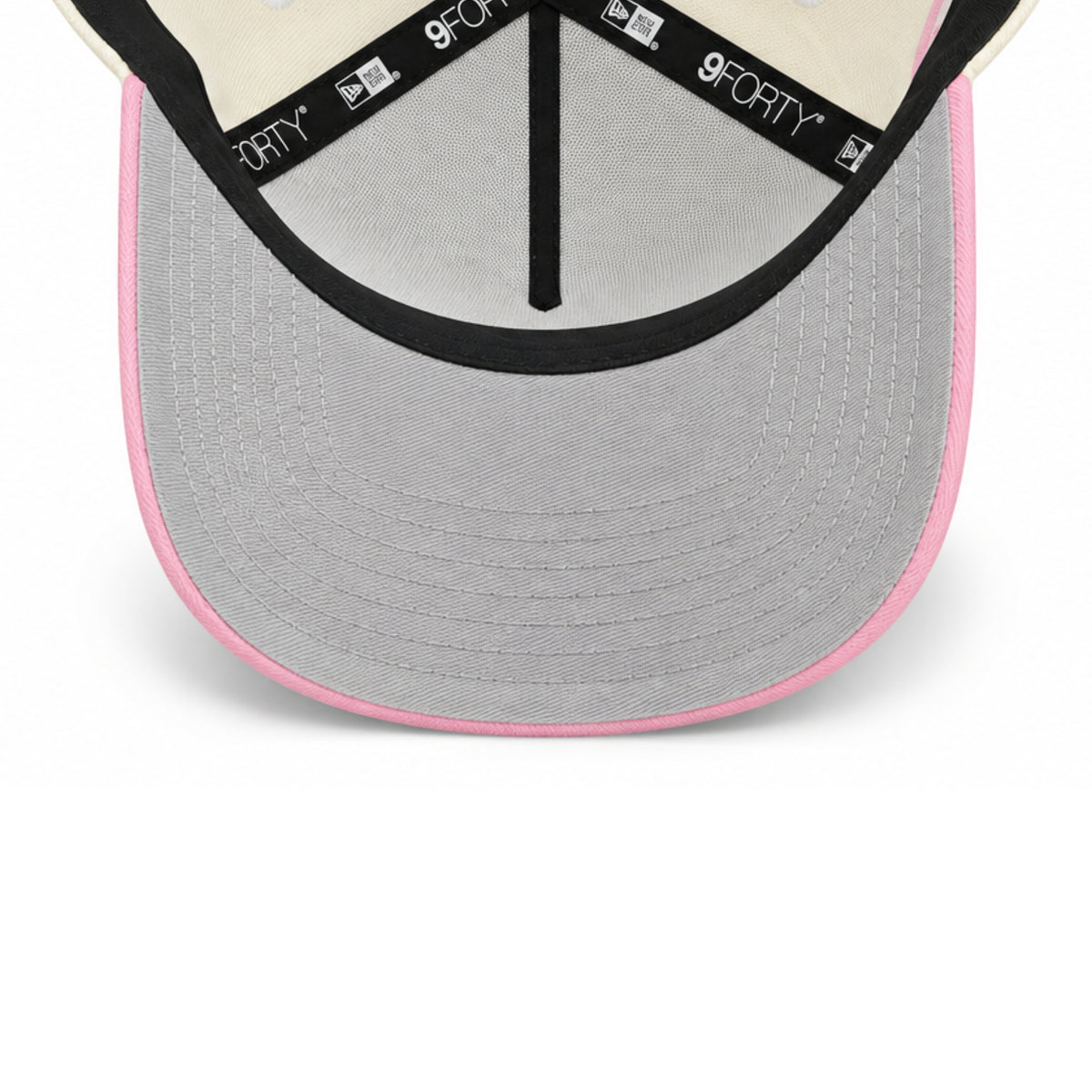 Undervisor view of New Era Dodgers Chrome Pink 9FORTY A-Frame snapback featuring gray undervisor, pink trim and branded interior taping