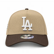 Front view of the New Era Los Angeles Dodgers 9FORTY A-Frame snapback featuring a khaki crown, raised white LA logo and walnut brown curved visor