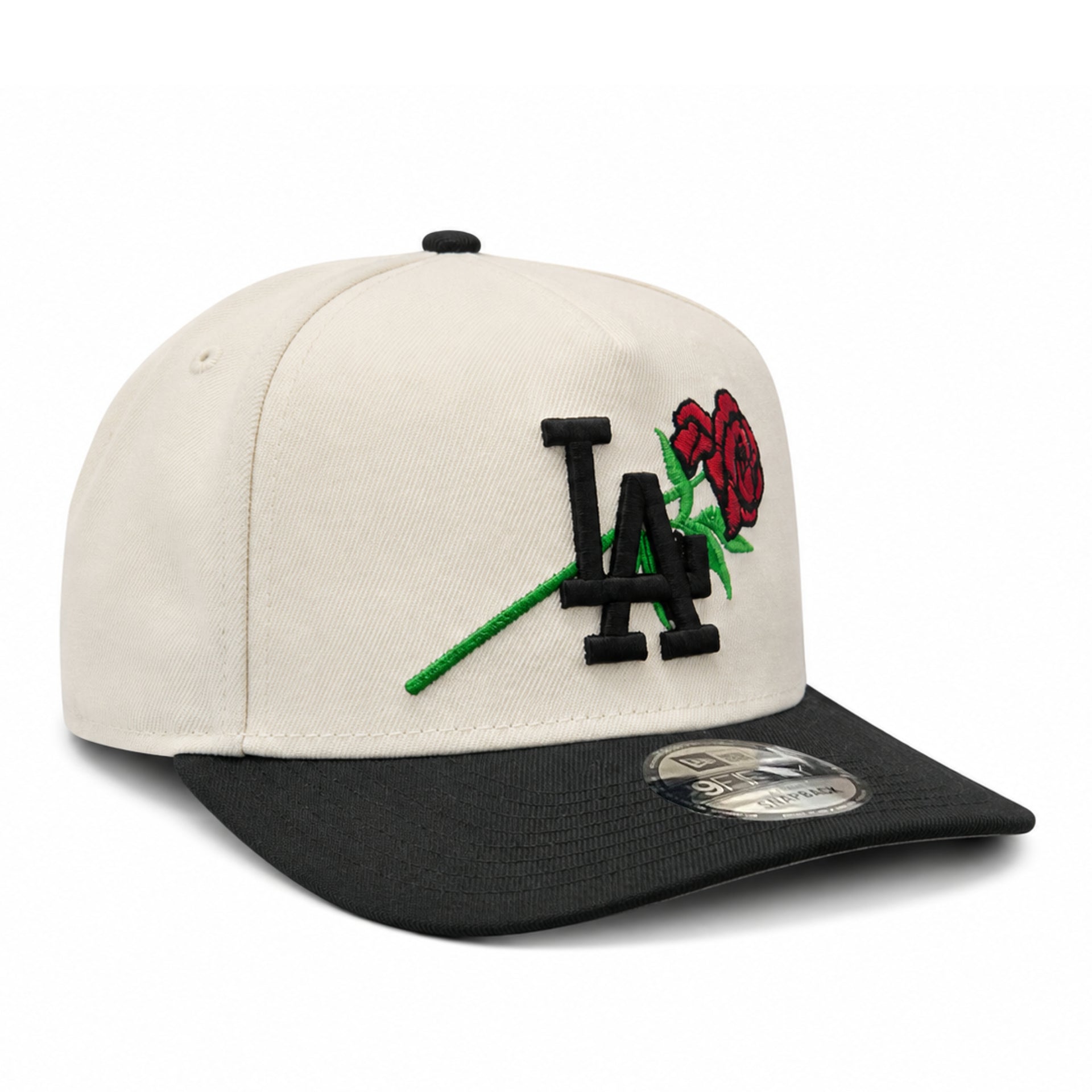 Beige and black cap with 'LA' logo and roses on a white background