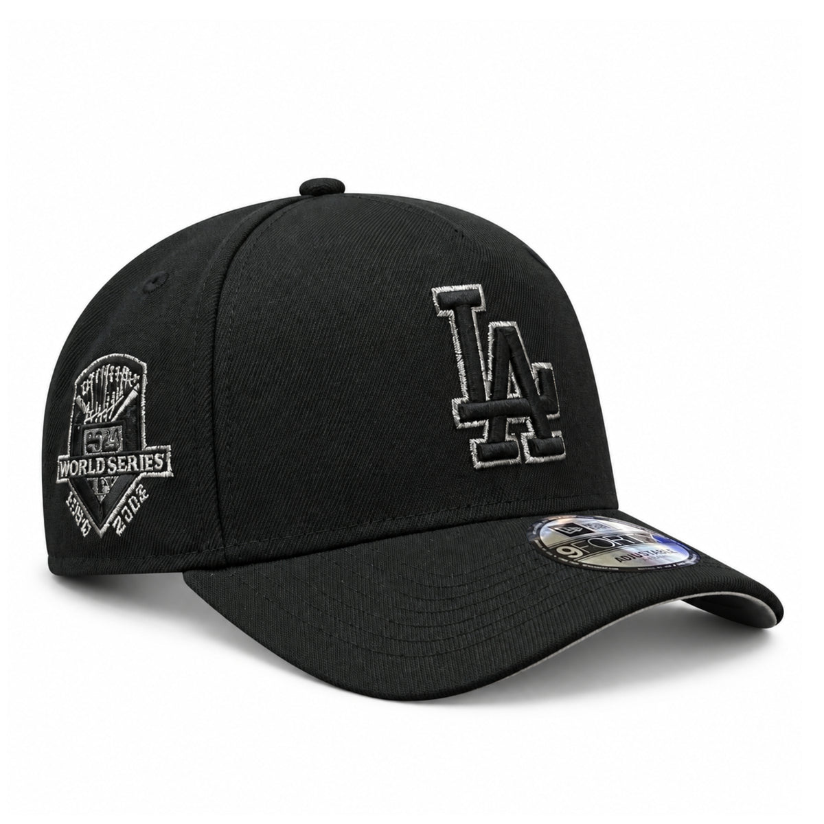 New Era Los Angeles Dodgers World Series Champions 9FORTY A-Frame snapback in black with metallic silver LA embroidery and commemorative side patch, front angled view