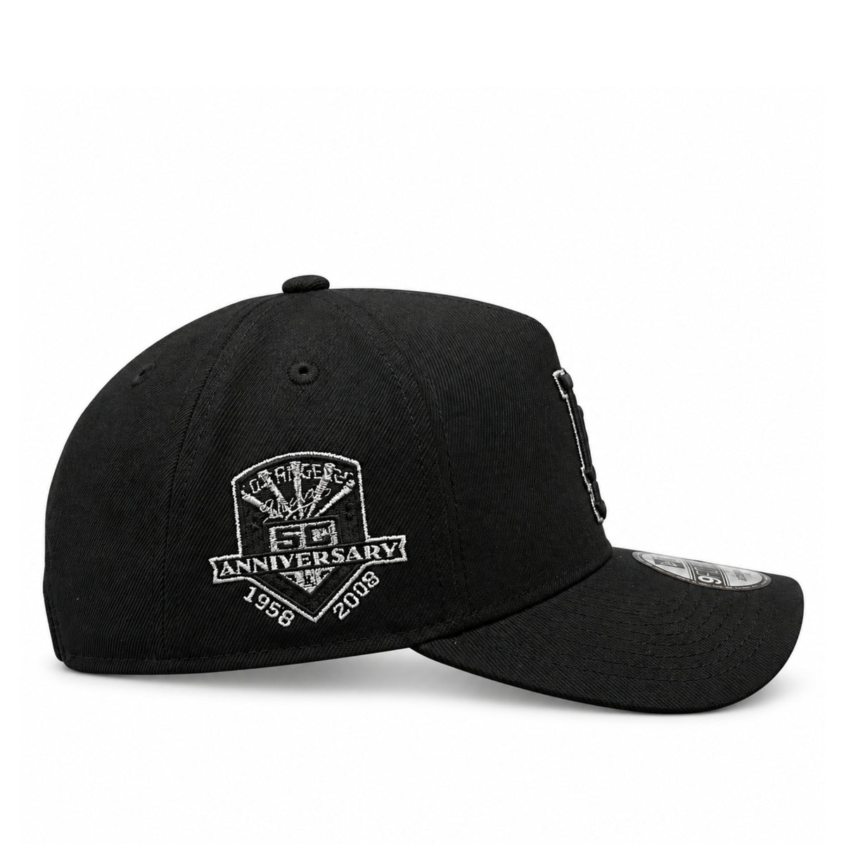 Side profile of black New Era Dodgers 9FORTY A-Frame cap featuring the metallic silver 2024 World Series championship patch and pre-curved visor