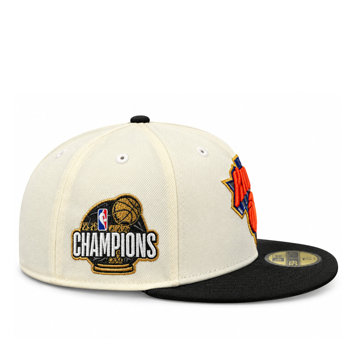 Side view of New Era New York Knicks 2026 Champions 59FIFTY fitted hat showing the embroidered championship patch on the chrome crown