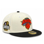 New Era New York Knicks 2026 Champions Chrome Black 59FIFTY fitted hat, front angled view with embroidered Knicks logo and championship side patch