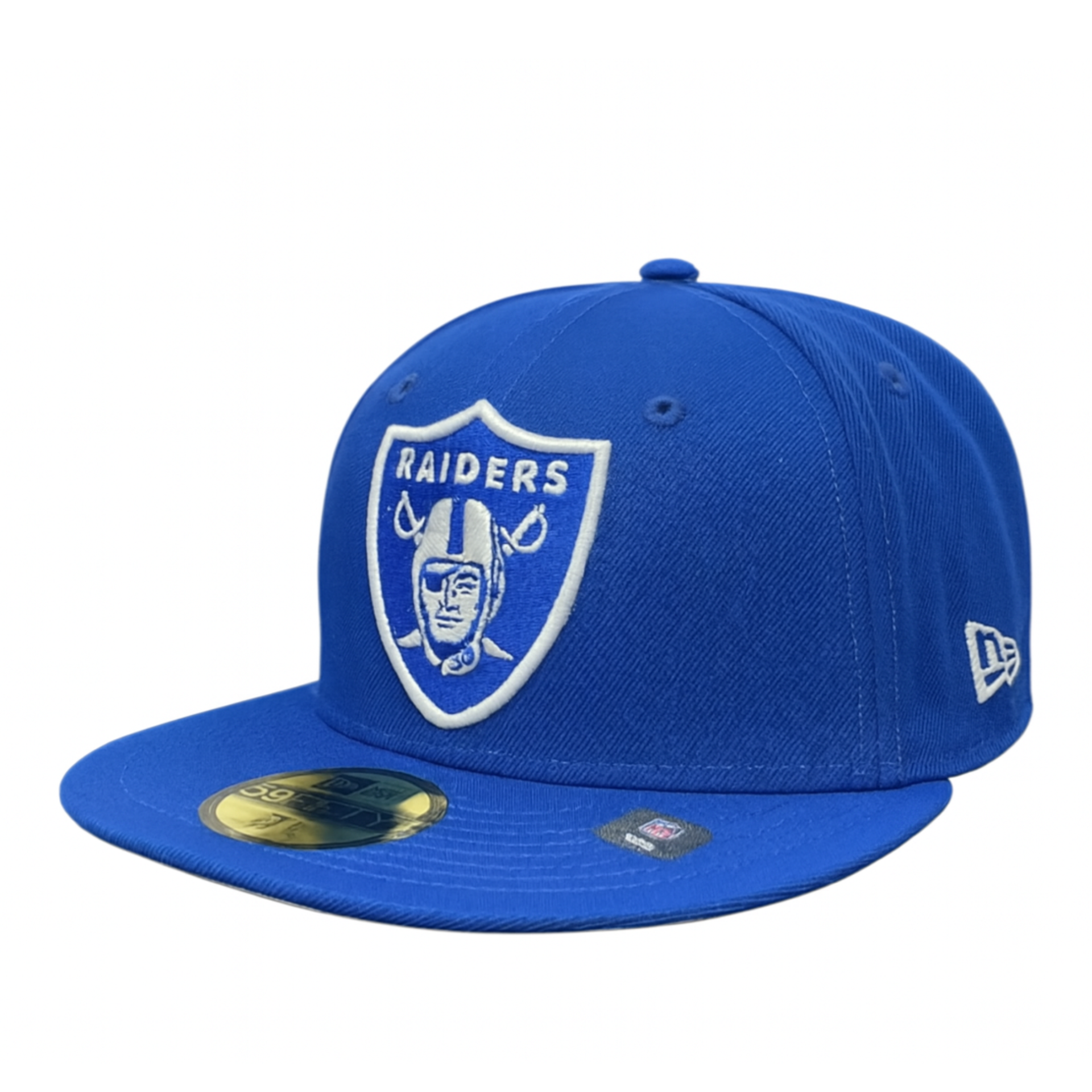 Royal blue Las Vegas Raiders New Era 59FIFTY fitted cap featuring a white embroidered team logo on the front and gold authenticity sticker on the flat brim, photographed against a white background.