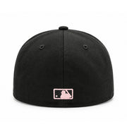 Rear view of the black New Era Los Angeles Angels 59FIFTY fitted cap featuring a pink embroidered MLB batterman logo and fitted closed back