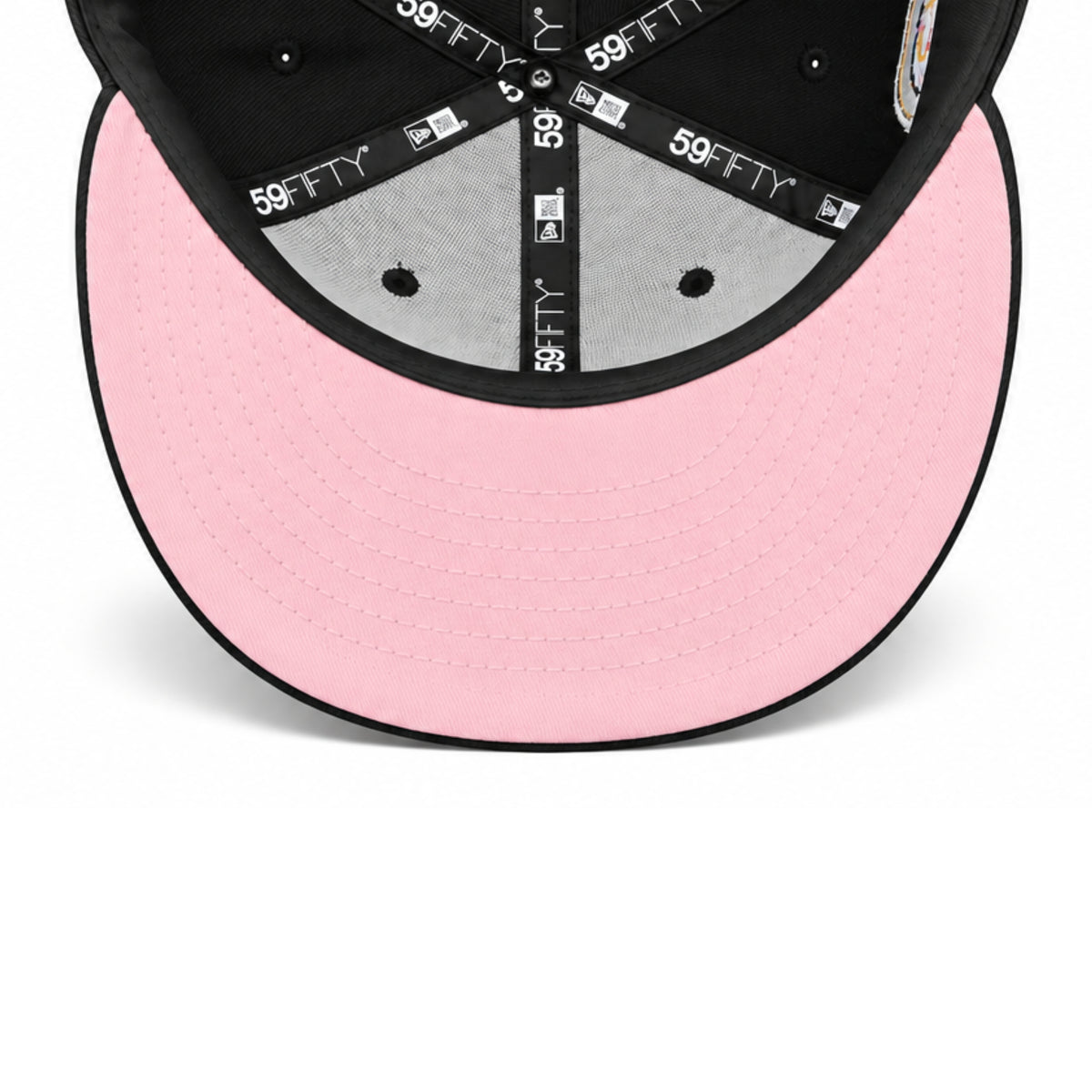 Underside view of New Era Los Angeles Angels 50th Anniversary 59FIFTY fitted hat showing the pink undervisor, black interior taping and Cooperstown Collection label