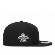A cream and navy blue New Era 59FIFTY fitted cap featuring a custom embroidered panda patch on the front, displayed on a clean white background.