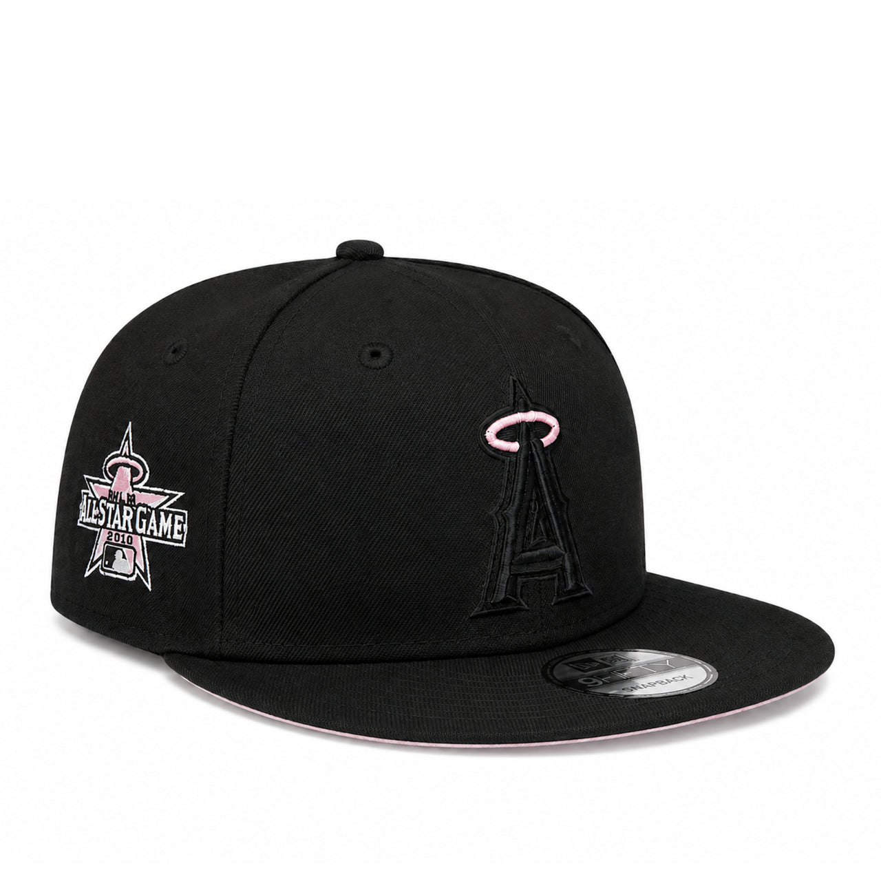 A black flat-brim baseball cap featuring the Los Angeles Angels 'A' logo in black with a pink halo on the front, and a pink and white All-Star Game patch on the side. A silver New Era sticker is visible on the brim.