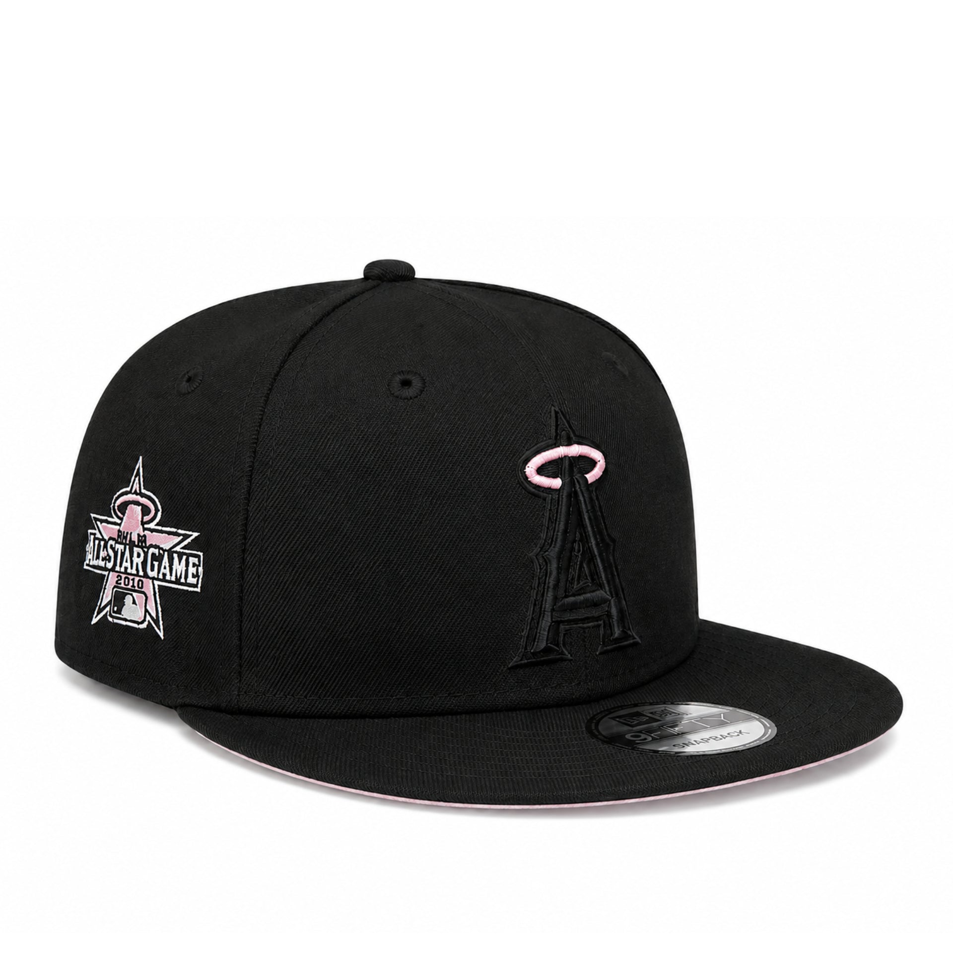 A black flat-brim baseball cap featuring the Los Angeles Angels 'A' logo in black with a pink halo on the front, and a pink and white All-Star Game patch on the side. A silver New Era sticker is visible on the brim.