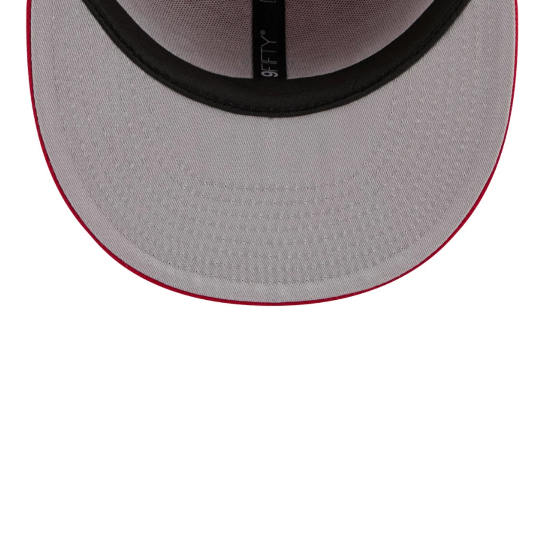 Close-up of a gray cap with red rim on a white background