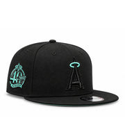 New Era Los Angeles Angels black 9FIFTY snapback hat with mint halo logo and 40th Season side patch, three-quarter view