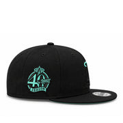 Side view of black Los Angeles Angels 9FIFTY snapback featuring the mint green Angels 40th Season embroidered patch