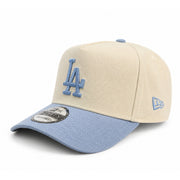 Beige and blue baseball cap with LA Dodgers logo on a white background