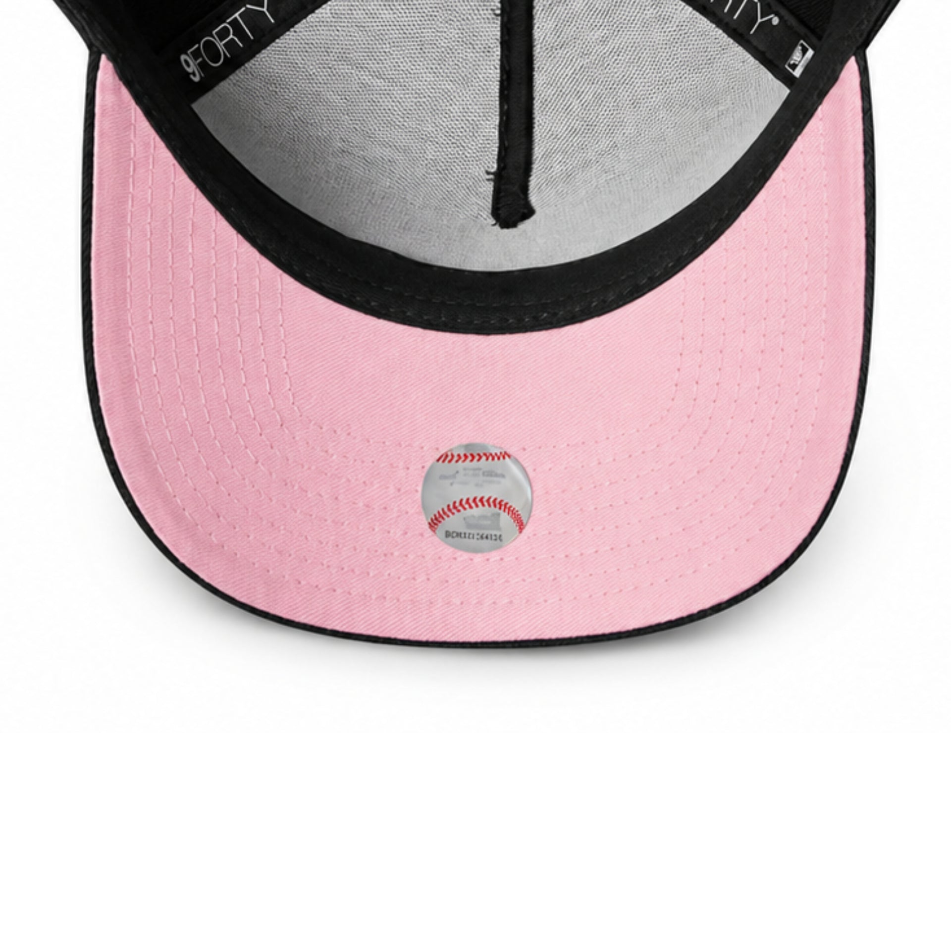 Pink baseball cap with a baseball graphic on a white background