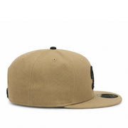 Beige cap with black accents on a white background