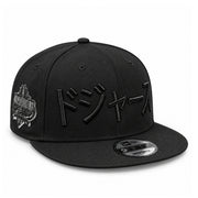New Era Los Angeles Dodgers Japanese Black on Black 9FIFTY Snapback Hat - Pink Under Visor front angled view