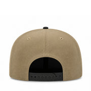 Beige cap with black interior and brim on a white background