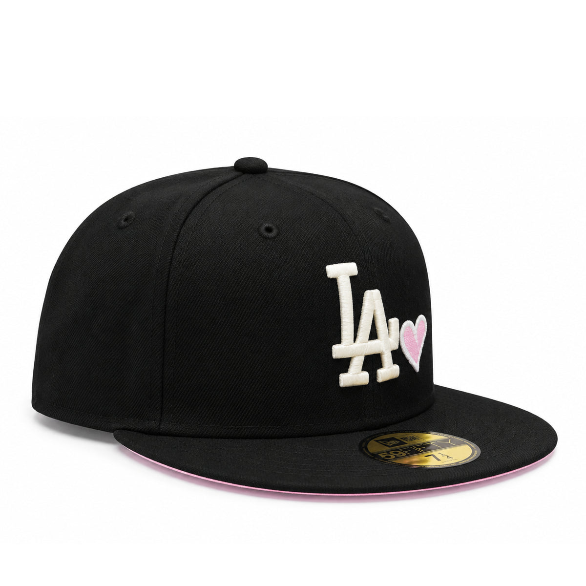 Angled view of black Los Angeles Dodgers 59FIFTY fitted cap featuring white LA logo, embroidered pink heart and pink undervisor