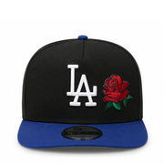 front view of New Era Los Angeles Dodgers Rose 9FIFTY A-Frame Snapback Hat in black and royal blue with embroidered LA logo and red rose detail.