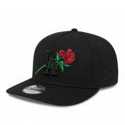 Black cap with embroidered rose and logo on a white background